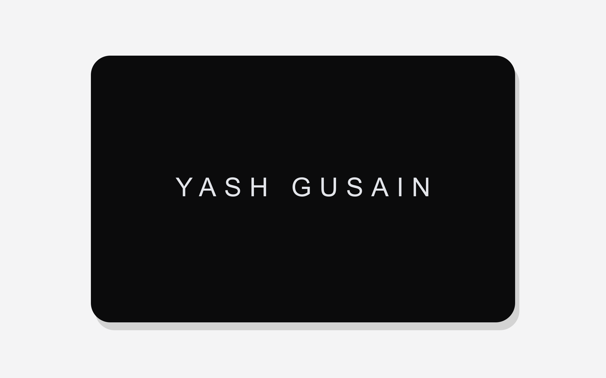 Alias Business Card — matte black with laser-engraved name
